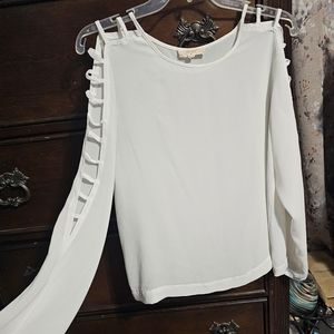 Sheer white blouse with open sleeves